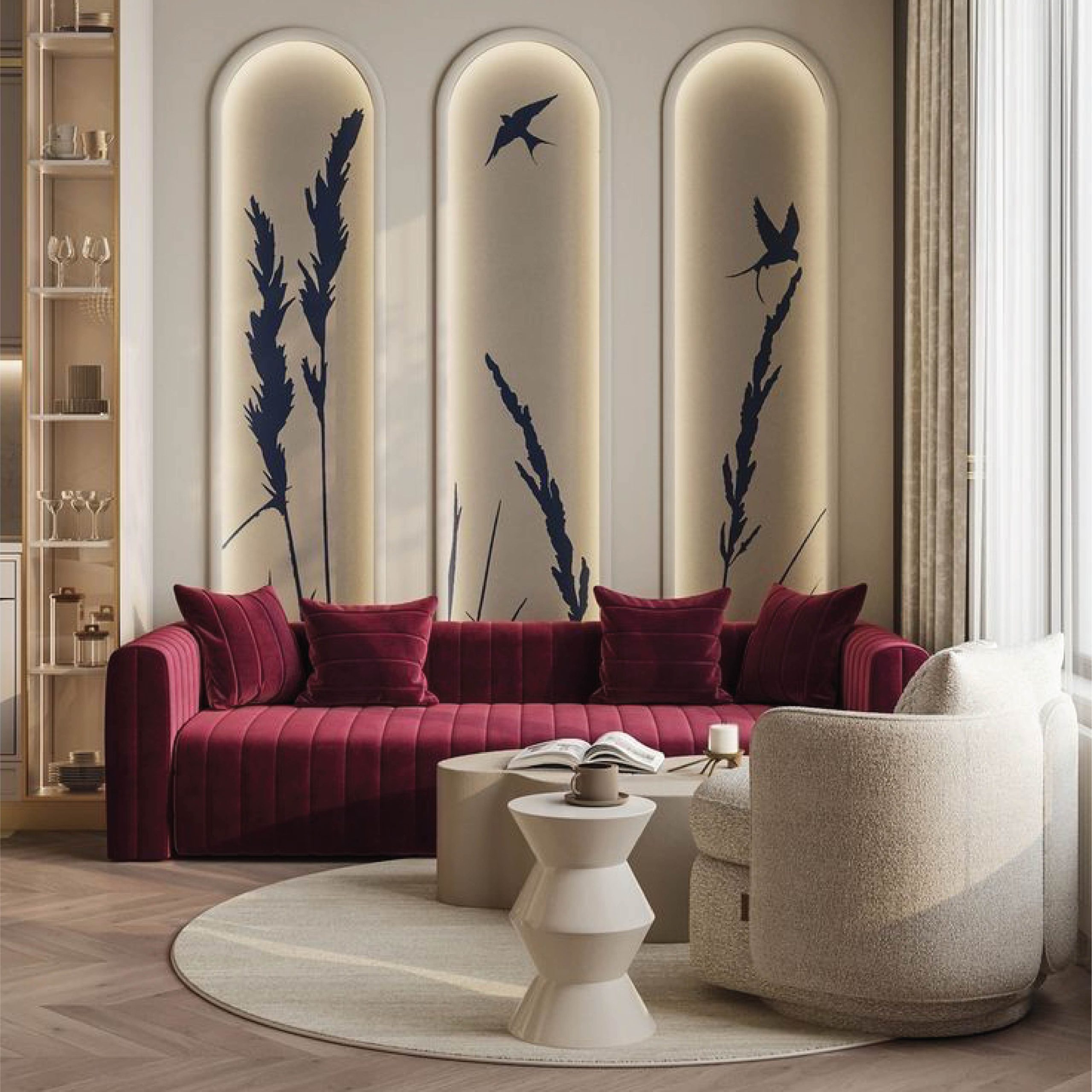The focal point is the wall behind the sofa, designed with three tall arched niches. Each niche has warm backlighting and minimalist artwork featuring delicate plants and birds, giving it an artistic, almost gallery-like feel.